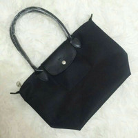 Tas longchamp planetes longhandle