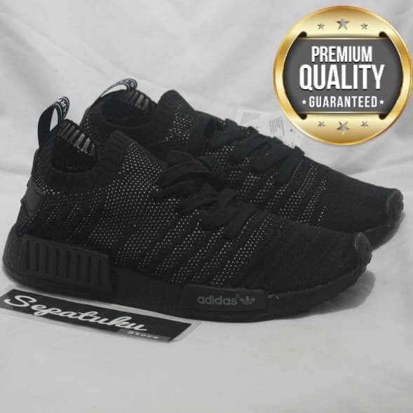nmd r1 primeknit stlt triple black