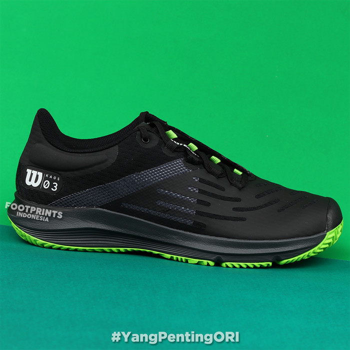 green and black tennis shoes