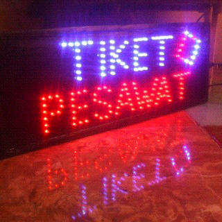 papan led usaha tiket pesawat